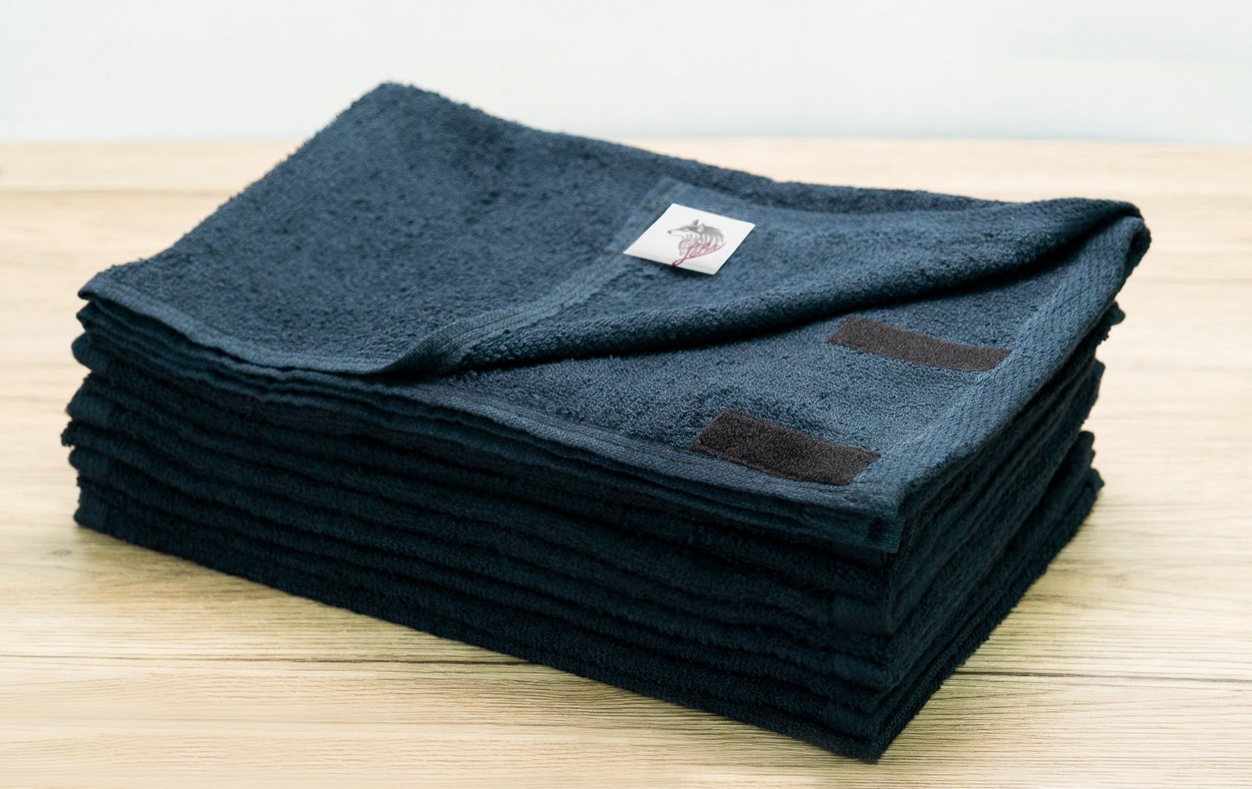 Folded cotton Style Wrap towels with their fastening details